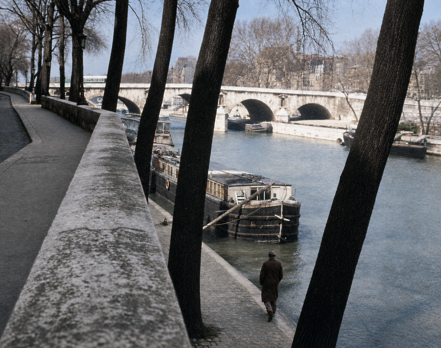 The edge of the river Seine: a deep and structured boundary. Layers and layers of walks, walls, stone, quays, and trees, all work to protect and enclose the river and make it more useful, more a living part of Paris.