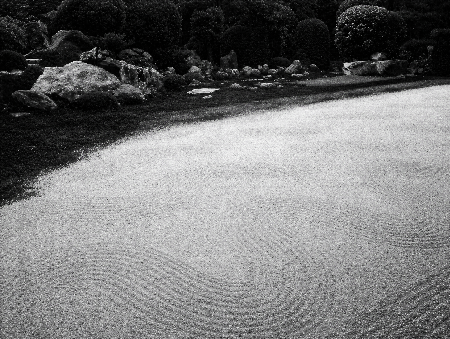 Ripples in a sand garden bring life to the place. It is the waves and troughs of the sand that cause the life, as every wave of sand becomes a living center.