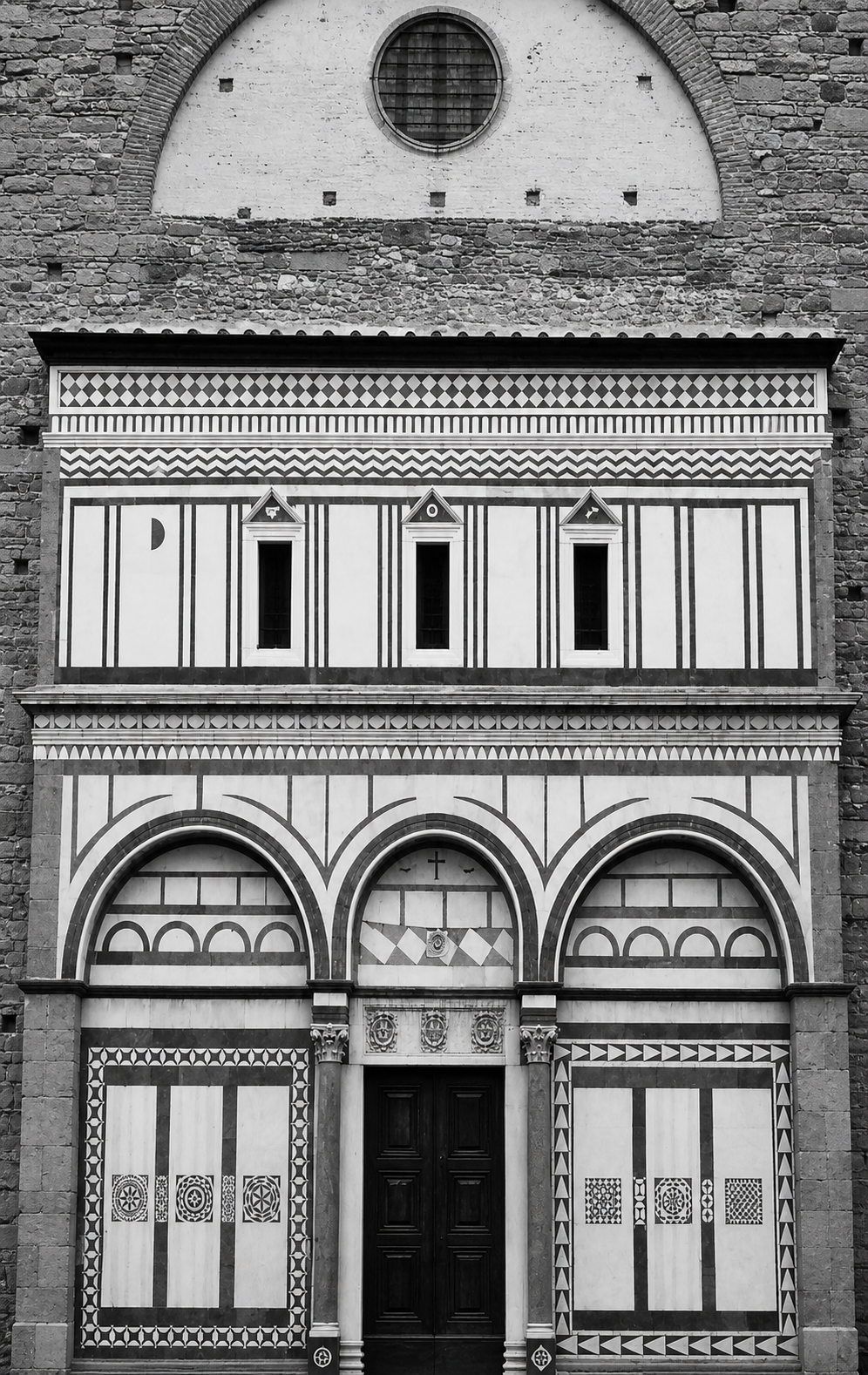 Tuscan church front: contrasts of rough and smooth, dark and light, solid and void are all working together.