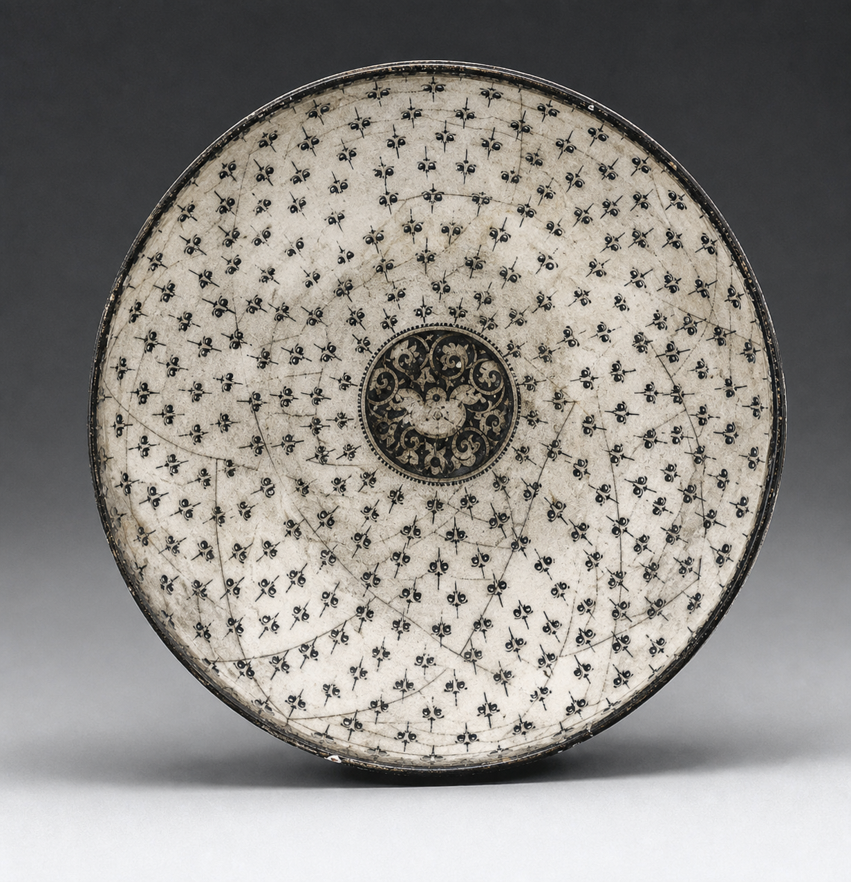 Persian bowl showing roughness in the beautiful drawing of the ornaments; they vary in position, orientetion, and according to the space formed by neighboring ornaments, and so make the space perfectly harmonious.