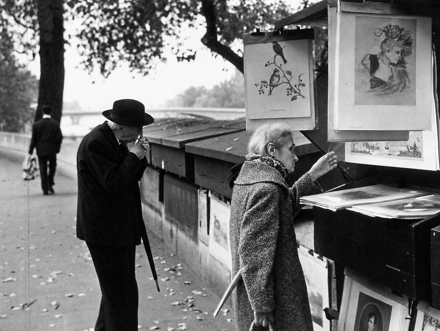 Looking through prints she cannot afford to buy