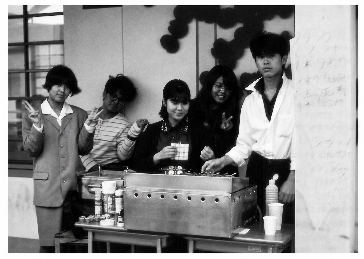 Selling hot food in one of the side streets of the school