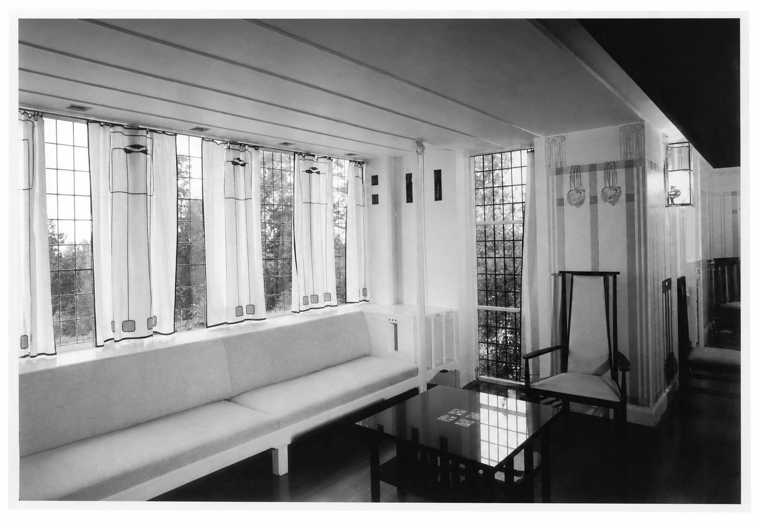 A beautiful center formed by the light of a window, as a major part of an important room. In this case, this is where the room's life comes from.